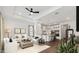 Bright living room featuring ample seating, stylish decor, and seamless transition to the modern kitchen at 20312 W Sells Dr, Buckeye, AZ 85396