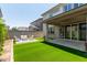 Enjoy outdoor living with artificial turf, a patio, and lush landscaping at 2067 N Marketside Ave, Buckeye, AZ 85396