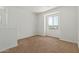 Bright bedroom filled with natural light from a large window at 2067 N Marketside Ave, Buckeye, AZ 85396
