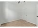 This bedroom features neutral tones and includes a ceiling fan and a closet at 2067 N Marketside Ave, Buckeye, AZ 85396