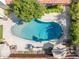 Overhead view of the sparkling backyard pool, complemented by shaded seating and privacy fence at 2236 E Sierra St, Phoenix, AZ 85028