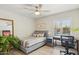 Inviting bedroom with a comfortable bed, natural light, and a functional workspace at 2236 E Sierra St, Phoenix, AZ 85028