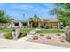 Inviting single-story home with manicured lawn, desert landscaping, and a picturesque walkway at 2236 E Sierra St, Phoenix, AZ 85028