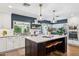 Modern kitchen with stainless appliances, white cabinets, and dark blue accent wall at 2236 E Sierra St, Phoenix, AZ 85028