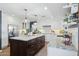 Spacious kitchen with a large island, white cabinets, and stainless steel fridge at 2236 E Sierra St, Phoenix, AZ 85028