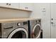 Modern laundry room featuring LG washer and dryer set with lots of cabinet space at 2236 E Sierra St, Phoenix, AZ 85028