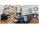 Stylish living room with gallery wall, modern furnishings, and glass block window at 2236 E Sierra St, Phoenix, AZ 85028