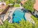 Stunning backyard featuring a private pool surrounded by mature trees and a patio with comfortable seating at 2236 E Sierra St, Phoenix, AZ 85028