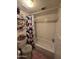 Bathroom with shower/tub combination and patterned curtain at 2301 E University Dr # 280, Mesa, AZ 85213