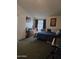Cozy bedroom featuring comfortable bed, dresser, and large posters at 2301 E University Dr # 280, Mesa, AZ 85213