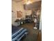 Bedroom with study desk, bed, and open entry to the ensuite bathroom at 2301 E University Dr # 280, Mesa, AZ 85213