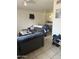 Cozy living room with tile floors, comfortable seating, and an open layout, perfect for relaxing and entertaining at 2301 E University Dr # 280, Mesa, AZ 85213