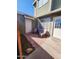 Charming front patio with light pink adirondack chairs and a hexagon brick patio at 2301 E University Dr # 280, Mesa, AZ 85213