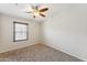 Neutral bedroom featuring carpet, ceiling fan, and one window at 2401 E Rio Salado Pkwy # 1047, Tempe, AZ 85288