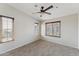 Neutral bedroom with carpet, ceiling fan and three windows at 2401 E Rio Salado Pkwy # 1047, Tempe, AZ 85288