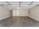 Empty two car garage with concrete floors and two doors at 2401 E Rio Salado Pkwy # 1047, Tempe, AZ 85288