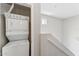 Hallway featuring stacked washer and dryer and carpeted stairs at 2401 E Rio Salado Pkwy # 1047, Tempe, AZ 85288