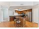 Modern kitchen featuring stainless steel appliances, an island with seating, and ample cabinet space at 2401 E Rio Salado Pkwy # 1047, Tempe, AZ 85288