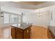 The kitchen is in the background from the kitchen island with chairs and the open living room at 2401 E Rio Salado Pkwy # 1047, Tempe, AZ 85288