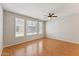 Spacious living room featuring wood floors, neutral paint, and a ceiling fan for comfort at 2401 E Rio Salado Pkwy # 1047, Tempe, AZ 85288