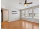 Bright living room with wood floors, ceiling fan and multiple windows offering lots of natural light at 2401 E Rio Salado Pkwy # 1047, Tempe, AZ 85288