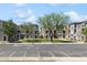 A parking lot in front of the townhouses with guest parking and handicapped parking spot at 2401 E Rio Salado Pkwy # 1047, Tempe, AZ 85288