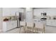 Spacious kitchen with white cabinets, stainless steel appliances, and a large island at 2993 E Mecklenburg Way, San Tan Valley, AZ 85143