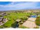 Expansive aerial view of the community park, showcasing volleyball, basketball, and green spaces at 30128 W Weldon Ave, Buckeye, AZ 85396