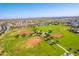 Aerial view of the community with lush green park, baseball fields, and well maintained landscaping at 30128 W Weldon Ave, Buckeye, AZ 85396