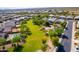 Aerial view of community featuring green space, a park, and neighborhood streets at 30128 W Weldon Ave, Buckeye, AZ 85396