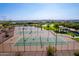 Community features aerial view of multiple tennis courts and greenery for residents at 30128 W Weldon Ave, Buckeye, AZ 85396