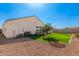 Well-maintained backyard with lush green grass, plants, and ample space for outdoor activities at 30128 W Weldon Ave, Buckeye, AZ 85396
