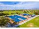 Aerial view of community basketball courts and park, offering recreational amenities for residents at 30128 W Weldon Ave, Buckeye, AZ 85396