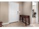 Inviting entryway with wood table decor and tile flooring at 30128 W Weldon Ave, Buckeye, AZ 85396