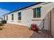 Exterior showcasing the side of the home with multiple windows at 30128 W Weldon Ave, Buckeye, AZ 85396