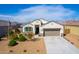 Charming home with well-manicured front yard and desert landscaping at 30128 W Weldon Ave, Buckeye, AZ 85396