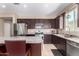 Well-equipped kitchen with stainless appliances, granite countertops, and ample cabinet space at 30128 W Weldon Ave, Buckeye, AZ 85396
