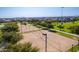 Aerial view of community sand volleyball court, a fun and active amenity for residents to enjoy at 30128 W Weldon Ave, Buckeye, AZ 85396