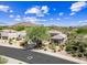 An aerial shot of the property and surrounding neighborhood with mountain views at 33317 N 71St St, Scottsdale, AZ 85266