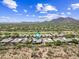 Expansive aerial view of a desert home, complete with a private pool and mountain views at 33317 N 71St St, Scottsdale, AZ 85266