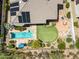 Overhead view showcasing a backyard with a swimming pool, putting green, and tiled patio at 33317 N 71St St, Scottsdale, AZ 85266