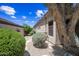The side yard features desert landscaping with gravel, stones, and shrubs at 33317 N 71St St, Scottsdale, AZ 85266