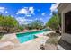 Private backyard retreat featuring a pool, water feature, desert landscaping, and a shaded swing set at 33317 N 71St St, Scottsdale, AZ 85266