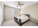 Comfortable bedroom with a ceiling fan, and light-filled window offering a serene retreat at 33317 N 71St St, Scottsdale, AZ 85266