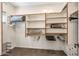 Organized walk-in closet with shelving and hanging space for optimal storage and organization at 33317 N 71St St, Scottsdale, AZ 85266