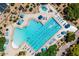 Aerial view of a community pool with many lounge chairs and umbrellas at 33317 N 71St St, Scottsdale, AZ 85266
