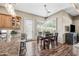 Well-lit dining area with wood table and chairs, and large windows with shutter-style blinds at 33317 N 71St St, Scottsdale, AZ 85266
