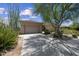 A wide driveway leads to a two-car garage, complemented by desert landscaping at 33317 N 71St St, Scottsdale, AZ 85266