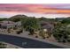 Dusk view of single story home with desert landscaping and mountain views at 33317 N 71St St, Scottsdale, AZ 85266
