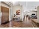 Grand foyer with hardwood floors, chandelier, and decorative console table with mirror at 33317 N 71St St, Scottsdale, AZ 85266